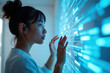 © YouraPechkin - Asian Woman Interacting with Futuristic Digital Screen Display Technology