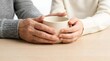 © SITI - Close up of senior and young hands holding warm ceramic mug together to show care support and love