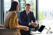 © Guille Faingold/Stocksy - Business Meeting in a Bright Office Space