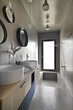 © adpePhoto - Modern bathroom interior with seamless resin walls and flooring, floating vanity