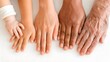 © Muhammad - Close-up of four diverse hands representing different generations and skin tones, from baby to elderly, symbolizing family, connection, and the passage of time.
