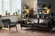 © Mediaphotos - Wide shot of counseling office showing sofa and chair arranged for adult couple therapy with female therapist, supporting mental health, relationship counseling, clinic marketing
