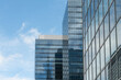 © Dirk - Brussels, Belgium. Modern glass office buildings with reflections of urban skyline and telecommunications tower