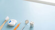 © Iryna - Dental hygiene tools arranged with clean copy space
