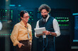 © Zamrznuti tonovi - Two it professionals working in a data center, discussing system configurations and digital infrastructure