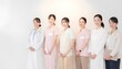 © 百合子 七尾 - 笑顔で並ぶ医療スタッフと介護スタッフのチームイメージ 医院 病院 介護施設 採用イメージ