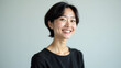 © Sameera - Against a Light Grey iteration Background ar Asian Woman With Short Dark Hair Wearing a