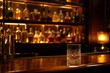 © Cahya - A crystal tumbler glass of premium whiskey on a dark wooden bar counter, conveying ultimate luxury, sophisticated nightlife, and refined hospitality relaxation.