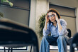 © Maria Vitkovska - Woman experiencing stress, headache, and burnout in office