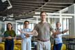 © Miljan Živković - Diverse business team welcoming clients to modern office