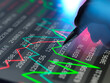 © Connect Images - Hand using a stylus on a digital stock market graph display showing rising and falling trends.