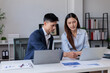 © Aompix - Team of Asian Business working at office with tax documents on his desk, doing planning analyzing the financial report, business plan investment, finance analysis concept