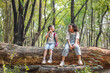 © kamonrat - Two Children Exploring Nature and Sharing Moments in Forest During Eco Education