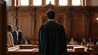 © forenna - Sentencing hearing courtroom with a judge reviewing pre-sentencing documents at the bench, defendant standing beside a public defender, gallery benches partially filled with