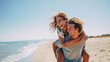 © Sergio IQstock - Couple in love enjoying summer by the sea. A joyful young woman piggybacking on her boyfriend, laughing and having fun. Romantic beach date, sun, ocean breeze, and genuine happines