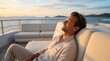 © bashkirovaphoto - Content man on a luxury yacht deck at sunset, eyes closed, radiating peace. Embodies the aesthetic of digital detox, celebrating freedom from gadgets and true disconnection.