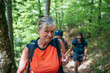 © Akela - from alp to alp/Stocksy - Smiling grandmother showing peace sign