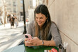 © Jelena Markovic/Stocksy - Everyday City Moments With Young Woman in Warm Sunlight