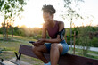 © Nunez Image SL/Stocksy - Woman relaxing with phone after running workout
