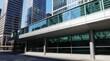 © Viktor - Modern glass skybridge connects office buildings. Sleek architecture with geometric patterns. Sunny day with clear reflections. Urban city center pathway.