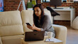 © DC Studio - Happy cheerful person chatting with online friends over the phone, in a cozy home interior.