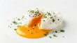 © Umnat - A perfectly poached egg with a runny yolk and herb garnish on a white background.
