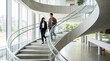 © InoStudiox - Professionnels Descendant un Escalier dans un Bâtiment Moderne