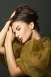 © millaf (Nemchinova) - Attractive woman hair. Beautiful model with long curly hairstyle posing