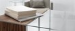 © AkuAku - Close perspective of composite material paper stack on hardwood supported glass table