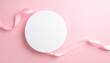 © nels - Elegant Pink Background with Ribbon and Blank Circle for Text or Design.