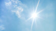 © Arjun Naja Ismail - blue sky background and shining sun. Heat wave concept. Extreme weather. Global warming effects