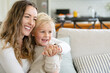 © Austockphoto - Mother cradles son on her lap in an embrace