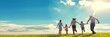 © Rahat - Happy family running together in a green field on a sunny day with blue sky