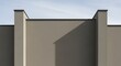 © MstFarjana - Minimalist facade featuring cimento queimado wall texture with clean lines and architectural geometry under a clear blue sky in modern building design
