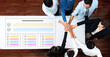 © InfiniteFlow - A group of diverse professionals joins hands in a circle around a table, symbolizing teamwork and collaboration in achieving common goals and successful outcomes. Cyphers