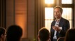 © SashaMagic - Charismatic Male Speaker Gesturing While Engaging Audience in Panel Discussion with Warm Golden Hour Lighting