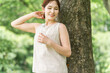 © buritora - A woman drinking water in the forest (hydration, mineral water, sodium)