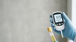 © Betty - Medical professional holding a digital urine test device and sample