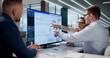 © Andrey Popov - Diverse Team Of Financial Analysts Is Reviewing Performance Data