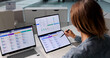 © Andrey Popov - Woman Reviews Candidate Profiles On Laptop