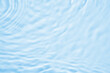 © Kwangmoozaa - Abstract transparent water shadow surface texture natural ripple on blue background
