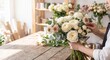 © Jana - Professional florist arranging a beautiful bouquet of fresh flowers