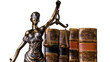 © Diego - Isolated Lady Justice statue holding scales next to antique law books, symbolizing legal system.