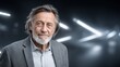 © Dmitry - Man with gray hair and beard poses indoors against a modern backdrop