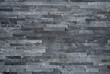 © Svetlana  - Background of textured natural stone tiles in grey color, modern dark gray slate stone wall cladding texture, elegant grey quartzite brick wall background for contemporary design