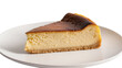 © David - Isolated a delicious slice of rich and creamy Basque burnt cheesecake dessert on a plate
