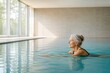 © Agnieszka - Senior Woman Swimming In Quiet Indoor Pool