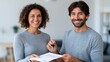 © alsu0112 - Smiling couple in casual attire exchanging house keys and documents in a bright modern interior, celebrating a successful real estate transaction