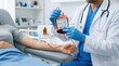 © Taras Roshchuk - A person receives a blood transfusion in a hospital. Medical staff checks the blood type and connects the blood bag to the patient's arm. The setting is a treatment room with medical equipment