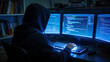 © middo - Person coding at computer in dark room